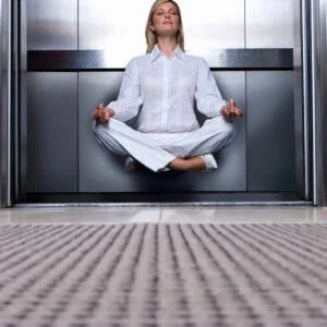 woman-meditates-in-elevator